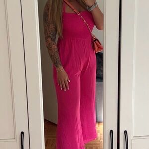 Lulus hot pink wide leg jump suit! Smocked top and open back. Worn once !